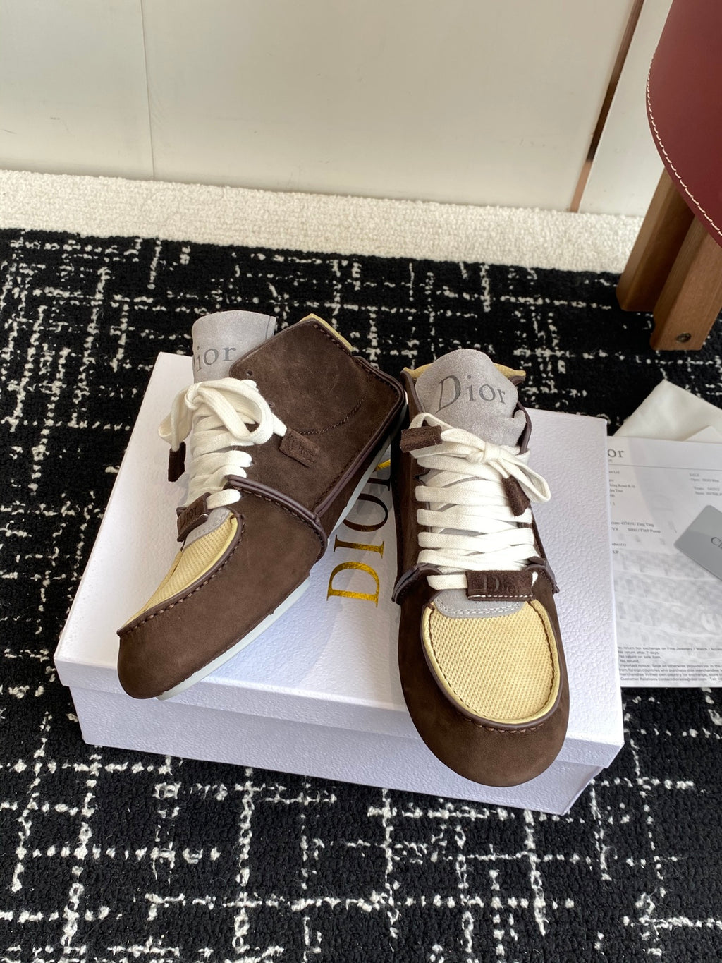 Dior unisex high-top sneakers, angled view, brown suede, white laces, and tan mesh trim