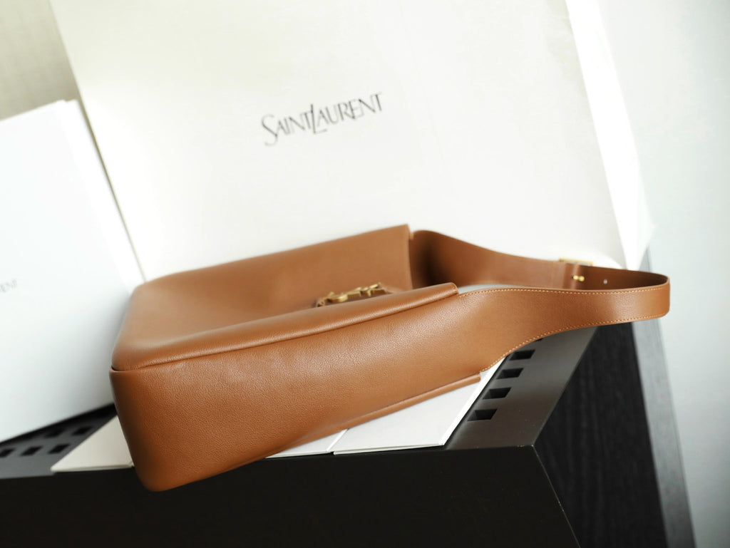 YSL brown leather bucket bag with top handle and gold-tone clasp detail