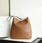 YSL brown leather bucket bag with short handle and adjustable strap
