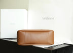 YSL brown leather pouch bag with center seam and rounded top