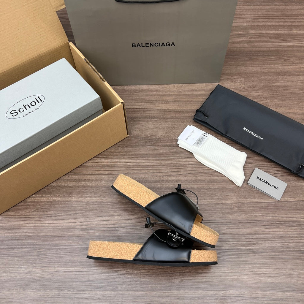 Balenciaga sandals, black leather slides with sling straps and tan cork footbed.