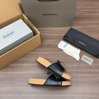 Balenciaga sandals, black leather slides with sling straps and tan cork footbed.