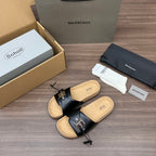 Balenciaga sandals, black leather slide with silver hardware and tan cork footbed.