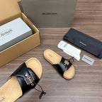 Balenciaga sandals, black leather mule style with silver buckles and tan cork footbed.