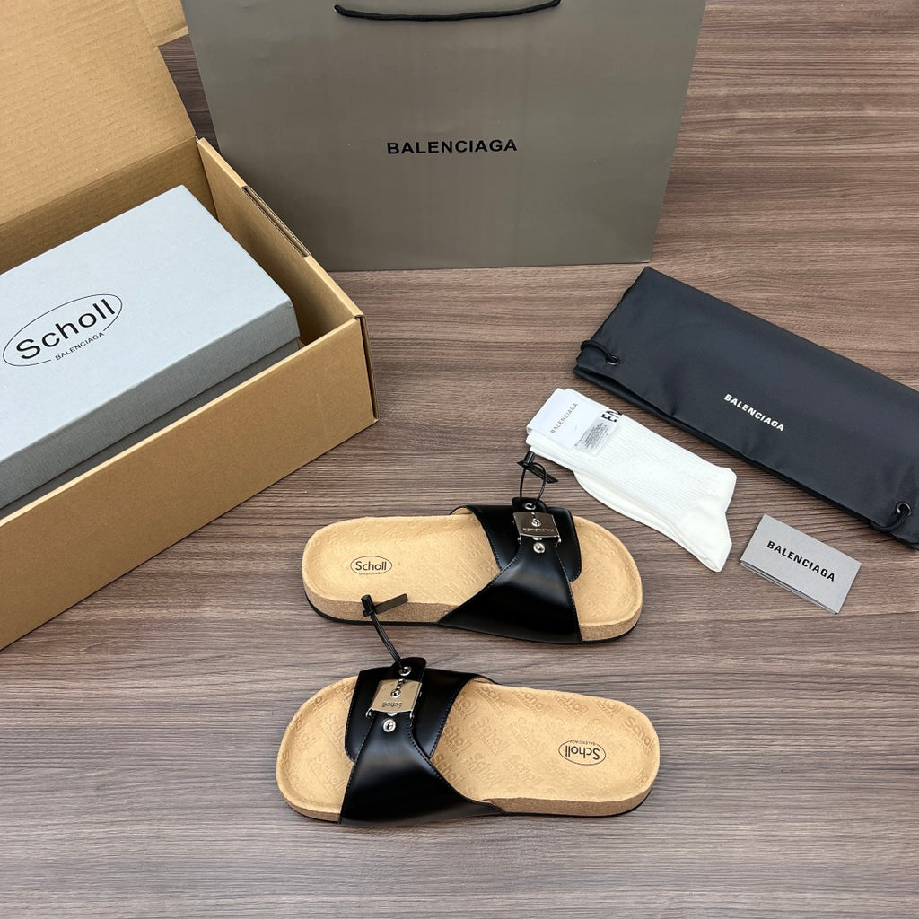 Balenciaga sandals, black leather slide with toe strap, tan cork footbed and buckles.