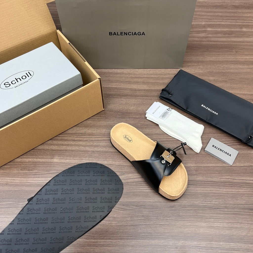 Balenciaga sandal, black leather strap with silver buckle and tan cork footbed.