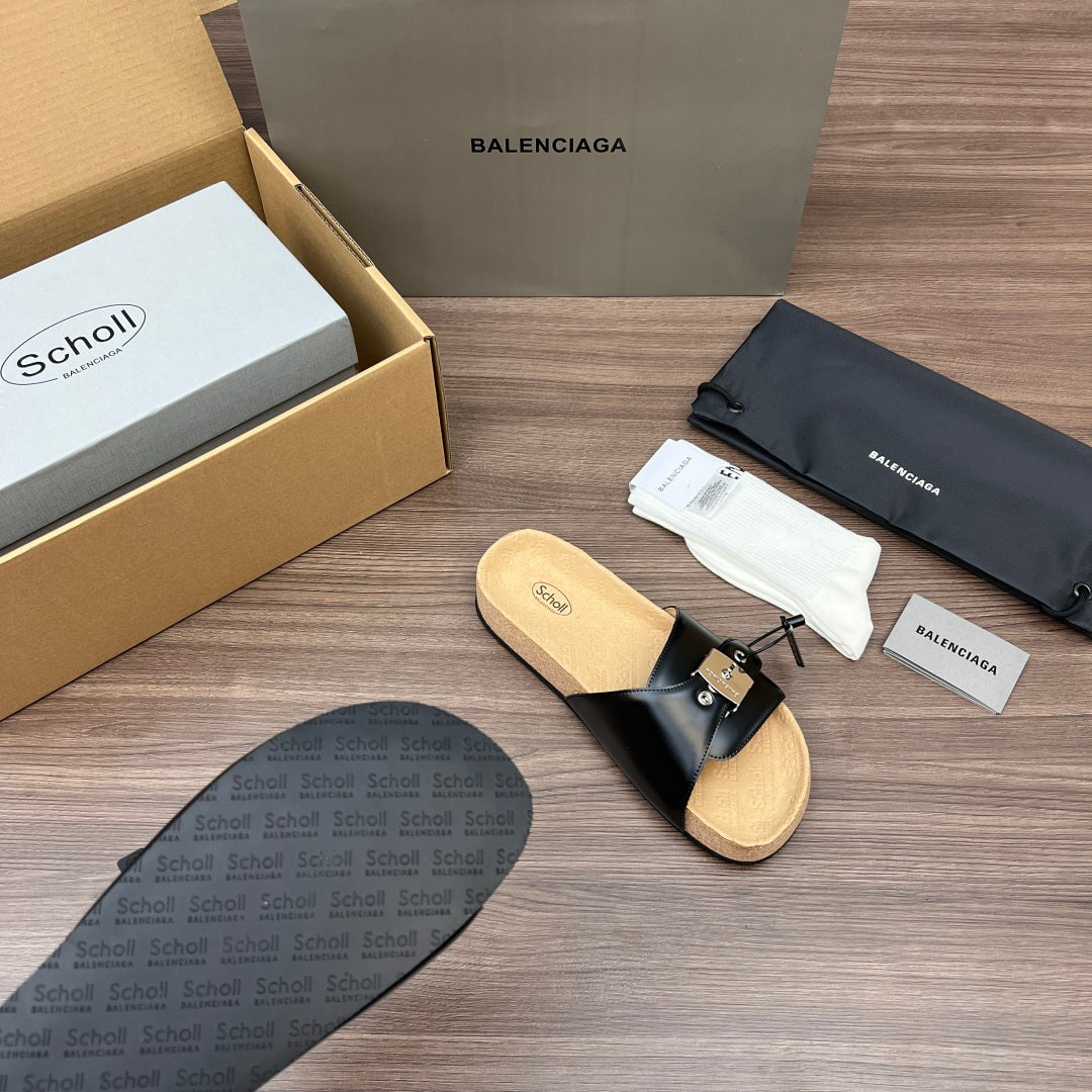 Balenciaga sandal, black leather strap with silver buckle and tan cork footbed.