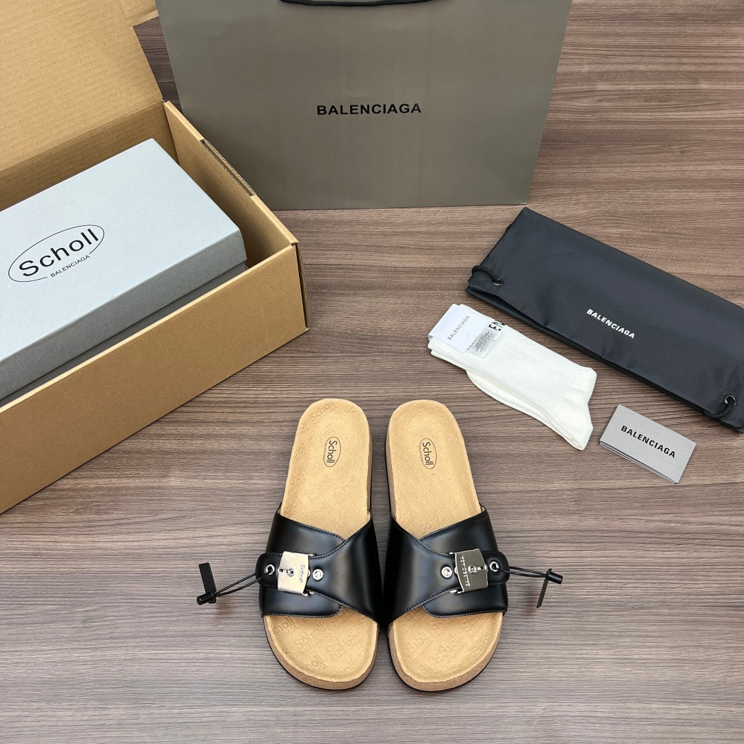 Balenciaga sandals with black leather straps and tan cork footbed, adjustable buckles.