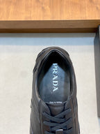 Black Prada unisex sneaker tongue and lace-up front, Prada logo branding