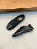 Black Prada unisex sneakers with lace-up tops, side and sole detail visible