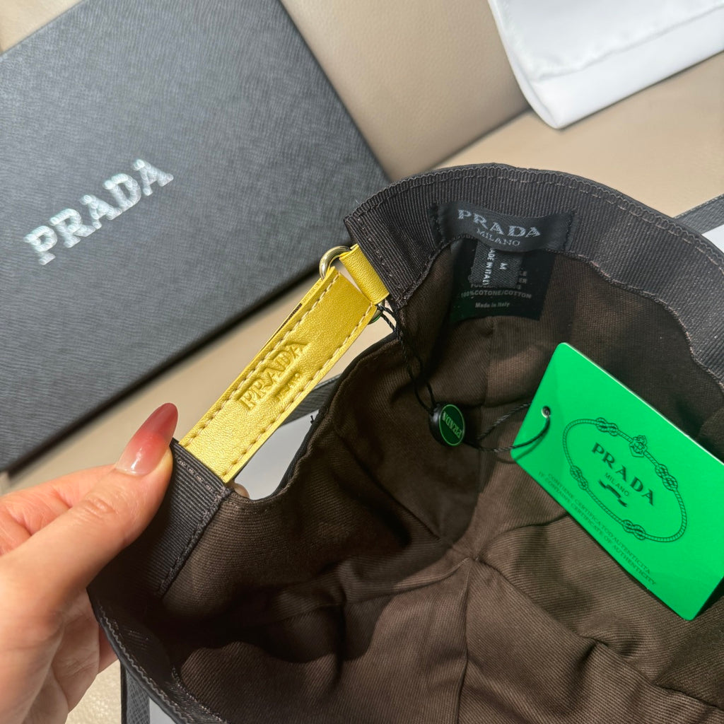 Black Prada baseball cap interior strap and green hang tag