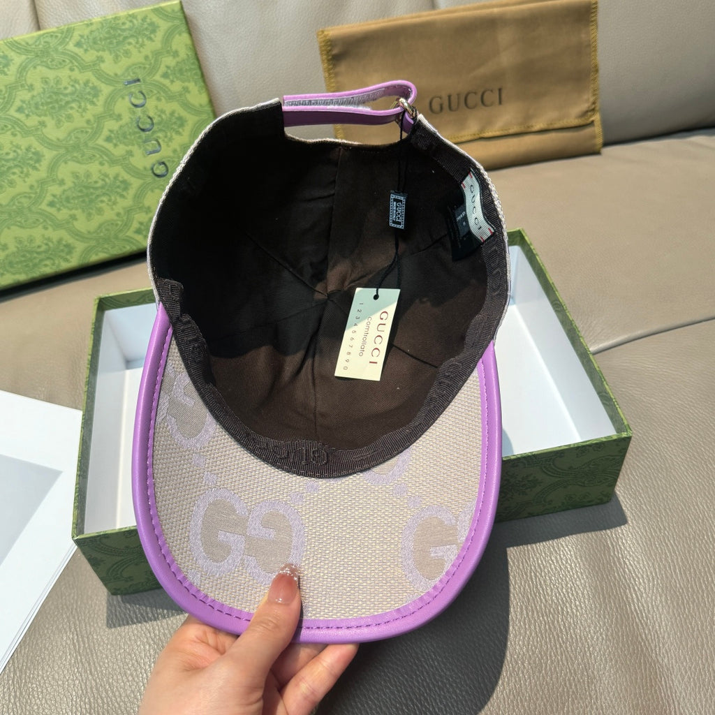 Gucci GG baseball cap with black interior lining, light beige exterior and purple brim.