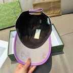 Gucci GG baseball cap with black interior lining, light beige exterior and purple brim.