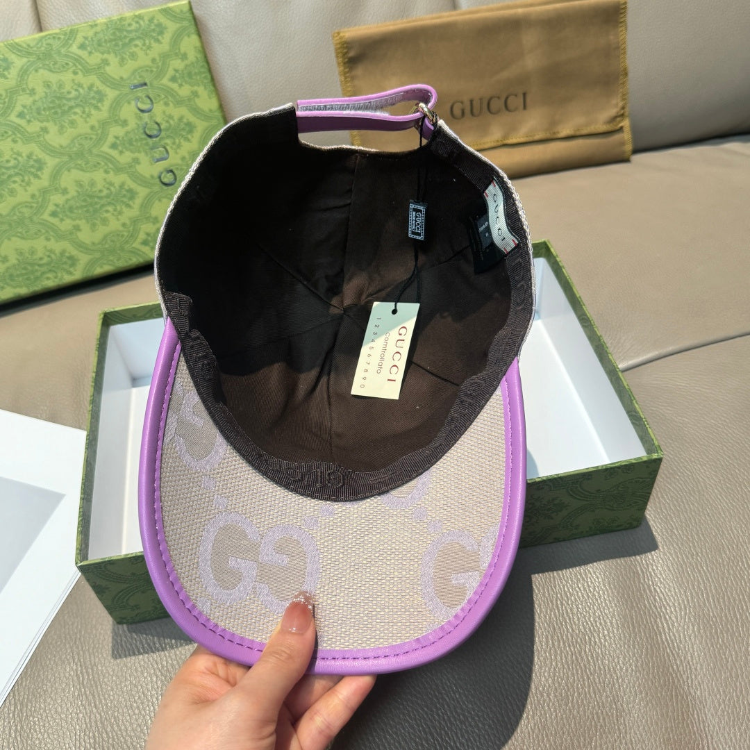 Gucci GG baseball cap with black interior lining, light beige exterior and purple brim.