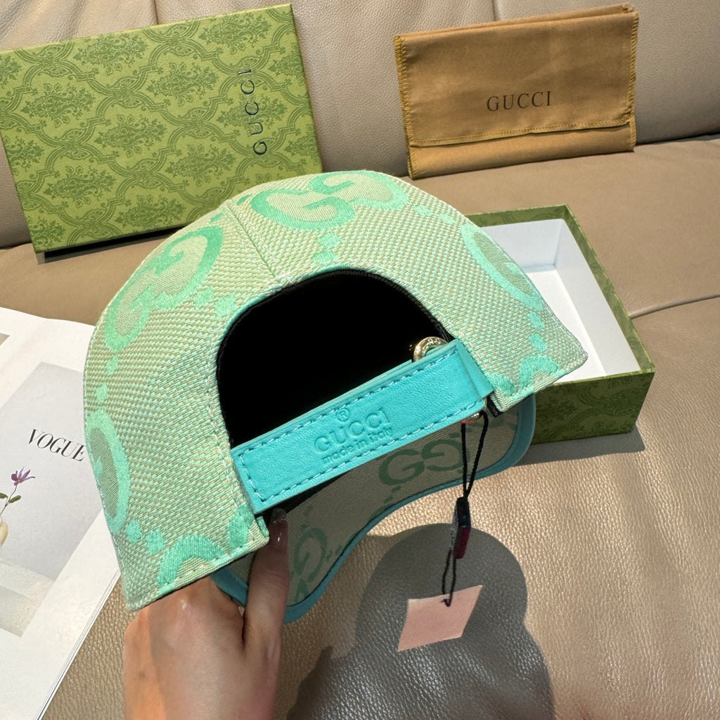 Gucci turquoise cap with GG logo pattern, teal inner band and black headliner