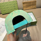 Gucci turquoise cap with GG logo pattern, teal inner band and black headliner