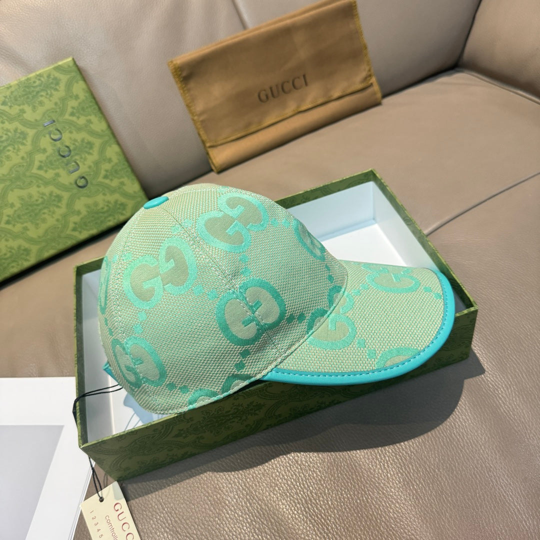 Gucci turquoise cap with GG logo pattern and teal brim edge, angled side view
