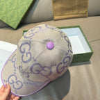 Gucci GG canvas baseball cap, light beige with purple top button and curved brim.