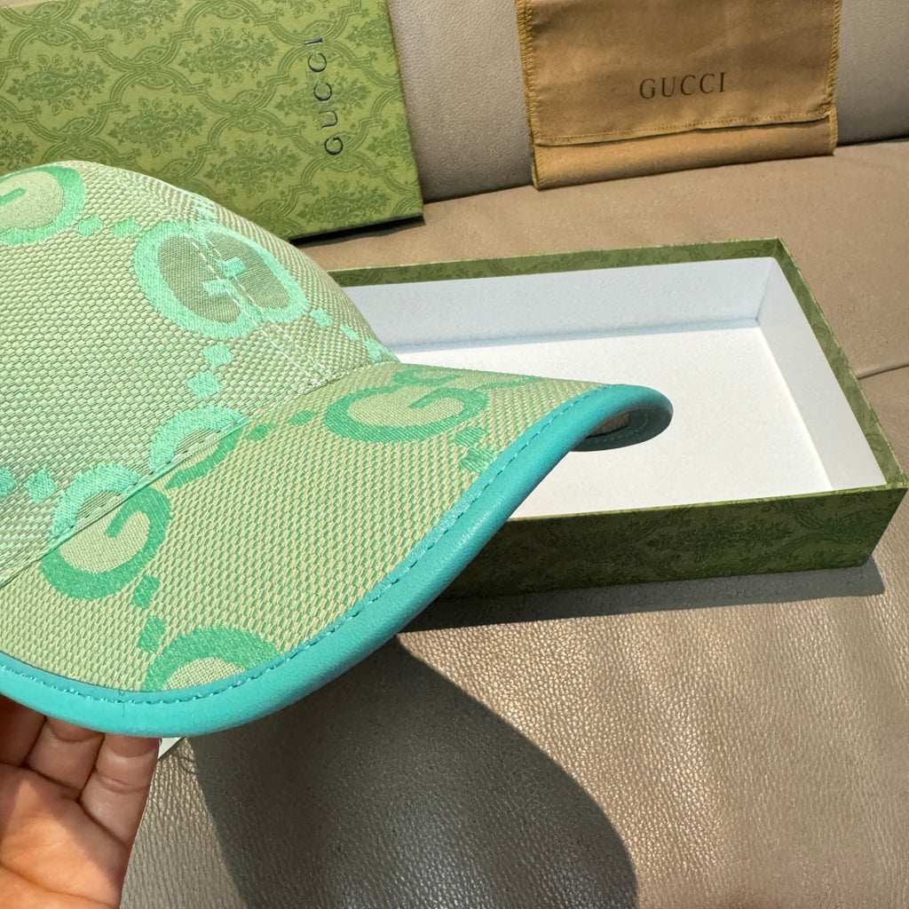 Gucci turquoise cap with GG logo pattern and teal brim edge, side profile
