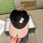 Gucci cap shown from inside, beige GG exterior with pink brim trim