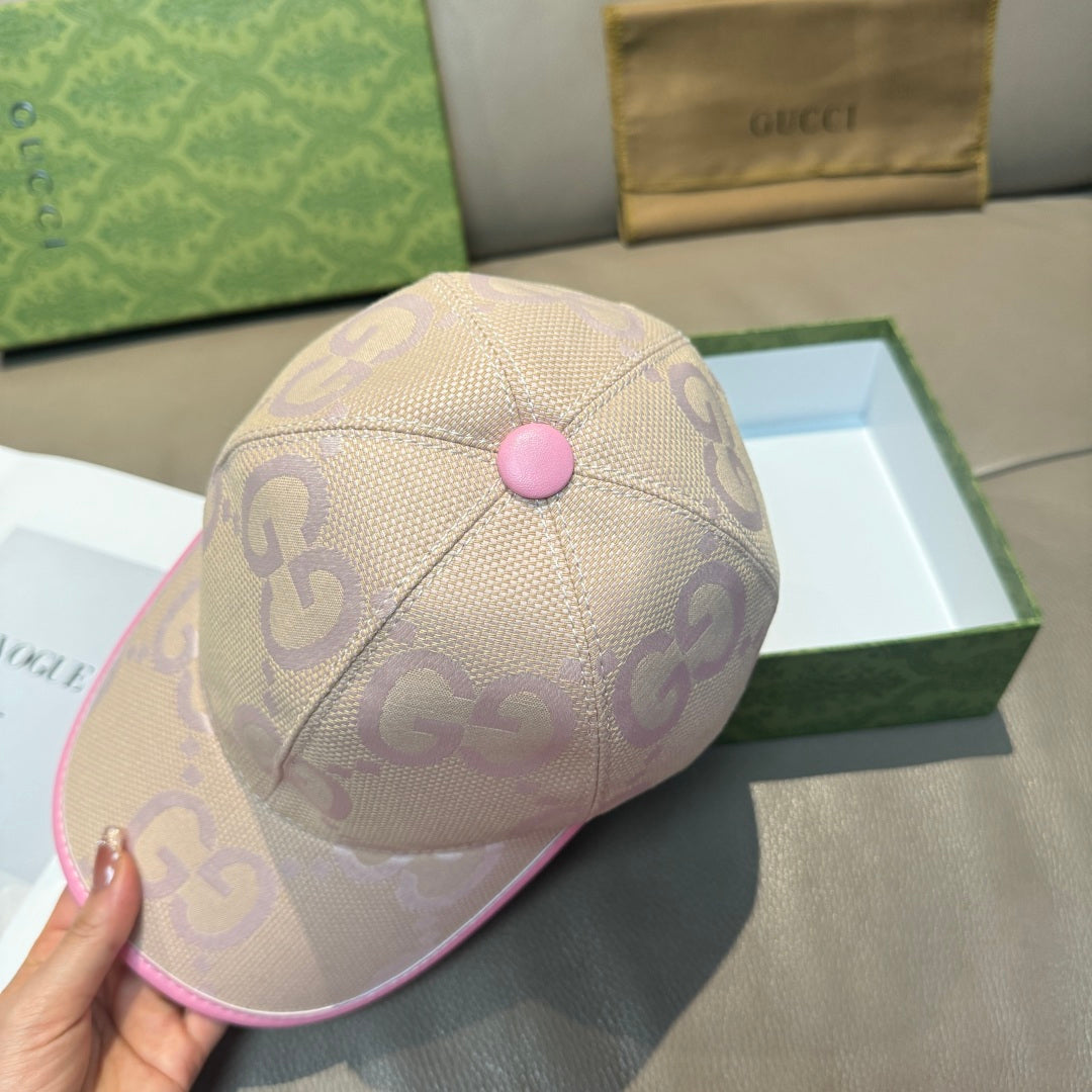 Beige Gucci GG cap with pink button and pink trim along the brim