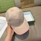 Beige Gucci GG cap with pink brim edge and small pink top button