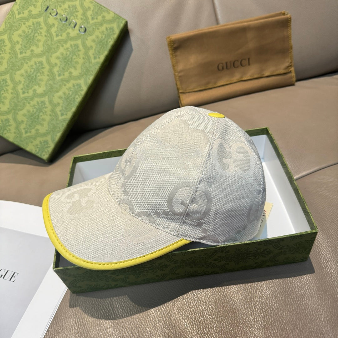 Gucci cap side view in white fabric with GG pattern and bright yellow edge