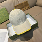 Gucci cap in white textured fabric with allover GG pattern and yellow trim