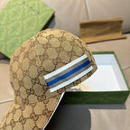 Brown GG monogram baseball cap with blue-and-white striped band and curved brim