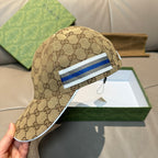 Brown GG monogram baseball cap with blue-and-white striped patch on crown