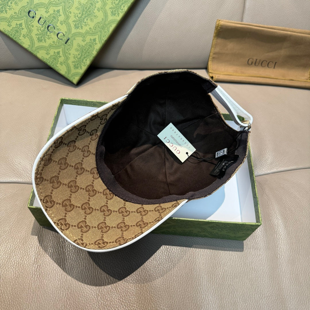 Brown GG monogram baseball cap with black interior lining and hanging tag