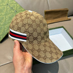 Beige GG monogram baseball cap with red, white, and blue stripe trim