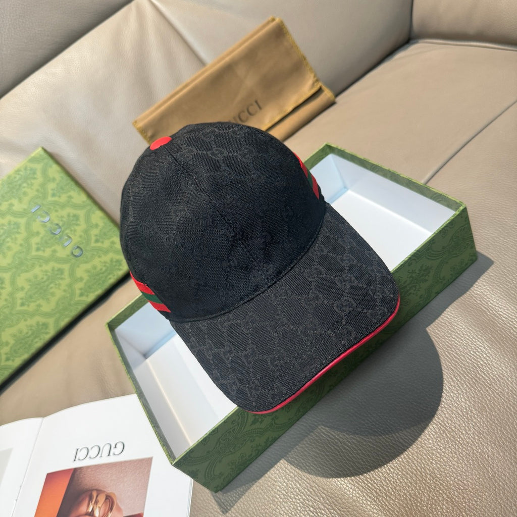 Black GG-pattern baseball cap with red and green Web stripe on the side.