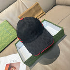 Black GG-pattern baseball cap with red and green Web stripe on the side.