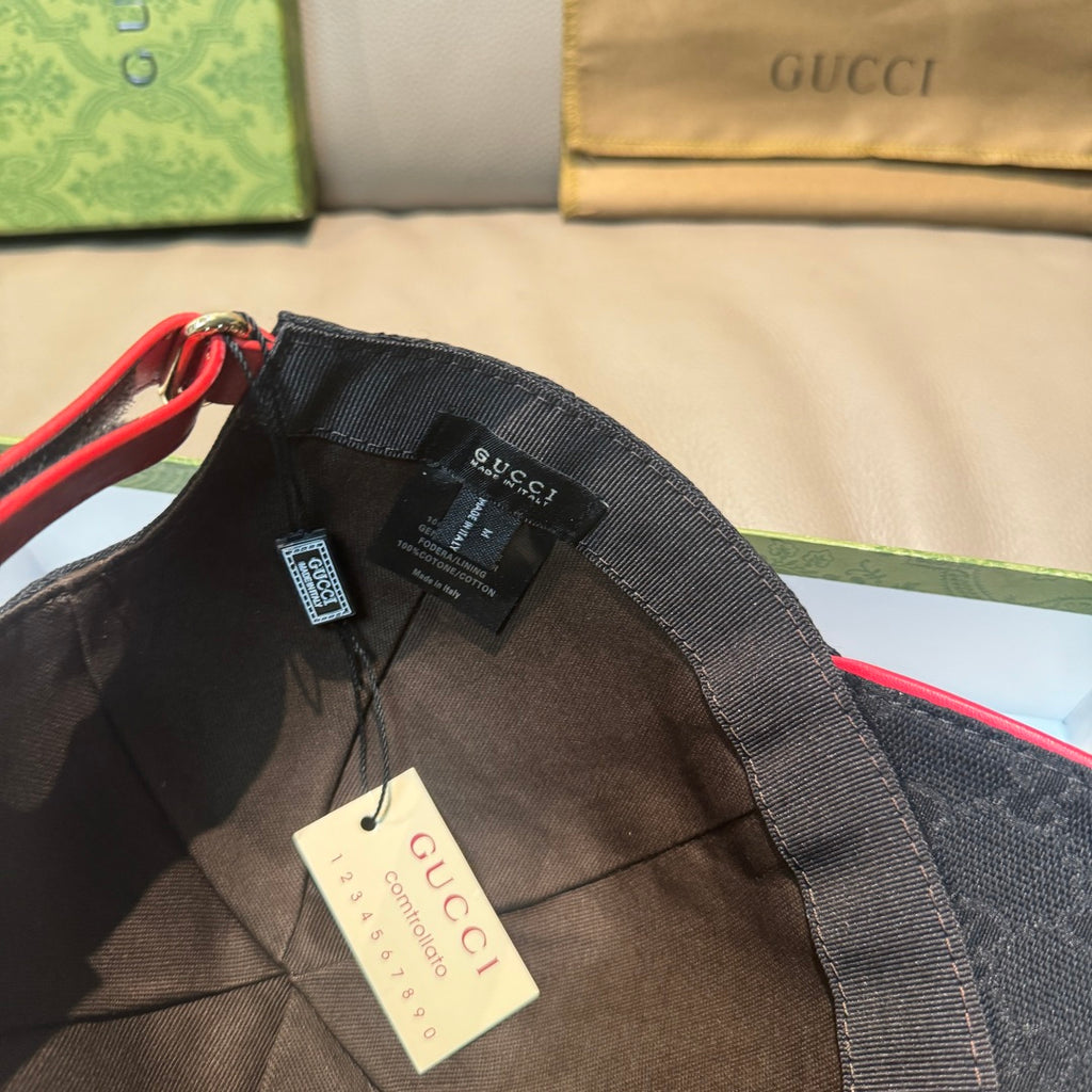Black baseball cap interior with adjustable strap and attached Gucci label.