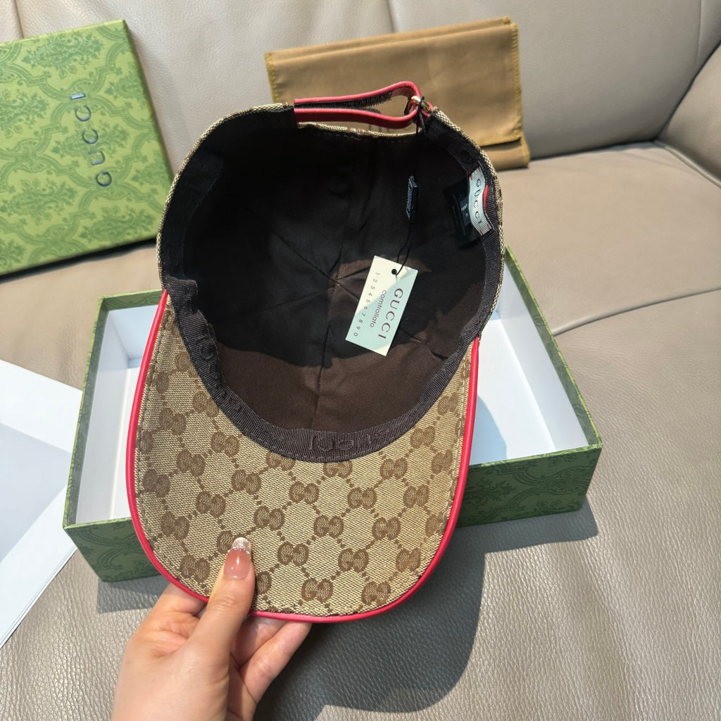 Gucci baseball cap with brown GG fabric and black interior lining, red trim edge