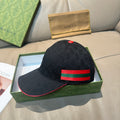 Black GG-pattern baseball cap with red and green Web stripe across the front.
