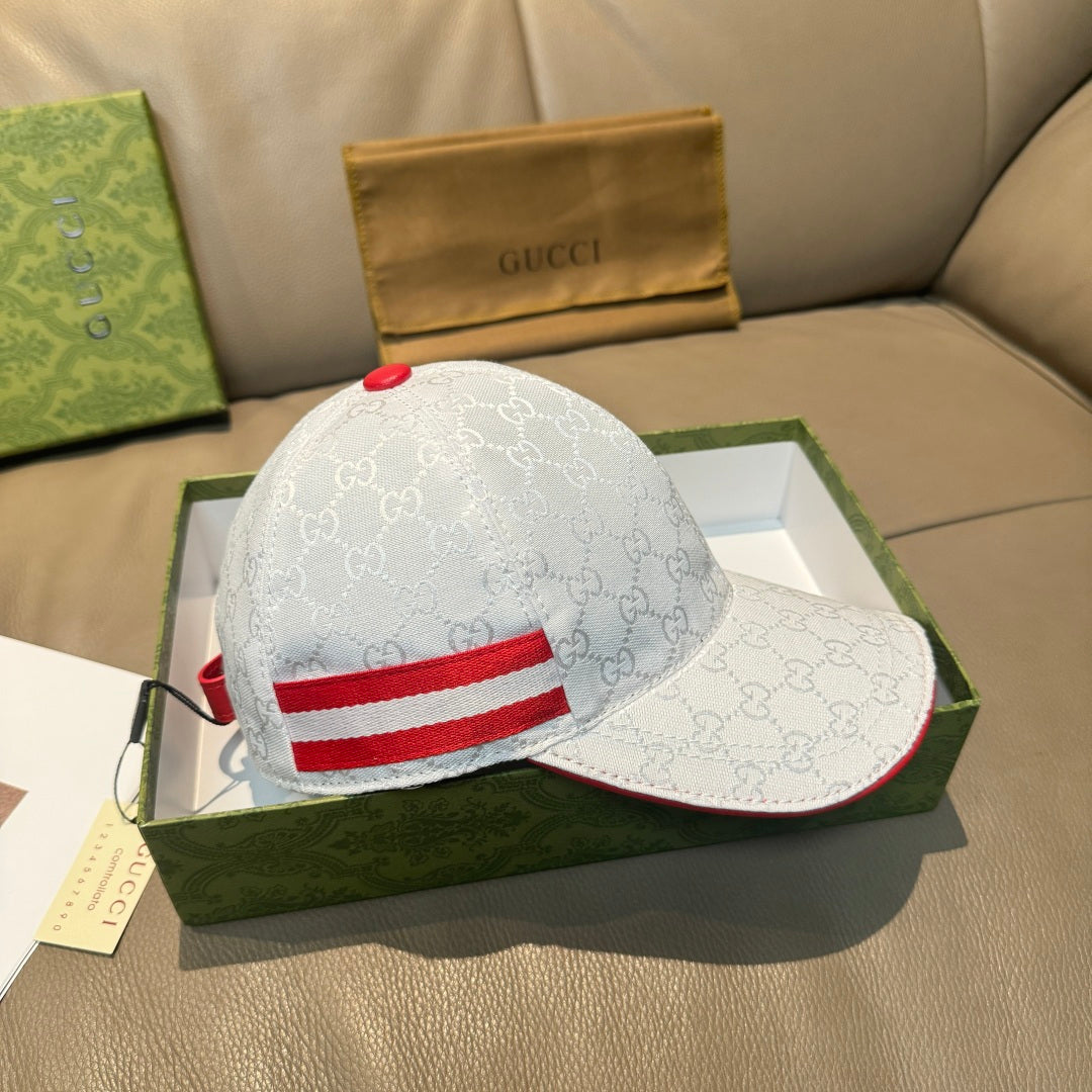 Gucci cap set: white GG monogram cap with red stripe detail and curved brim.
