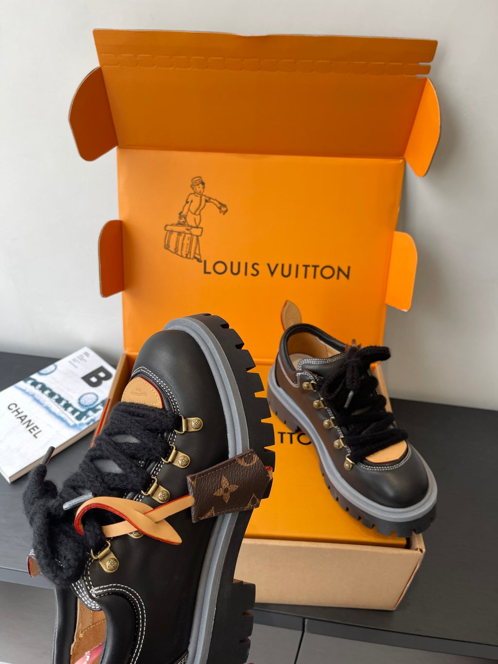 Louis Vuitton ladies sneakers: black lace-up with gold hardware, fur collar, thick sole