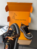 Louis Vuitton ladies sneakers: black lace-up with gold hardware, fur collar, thick sole