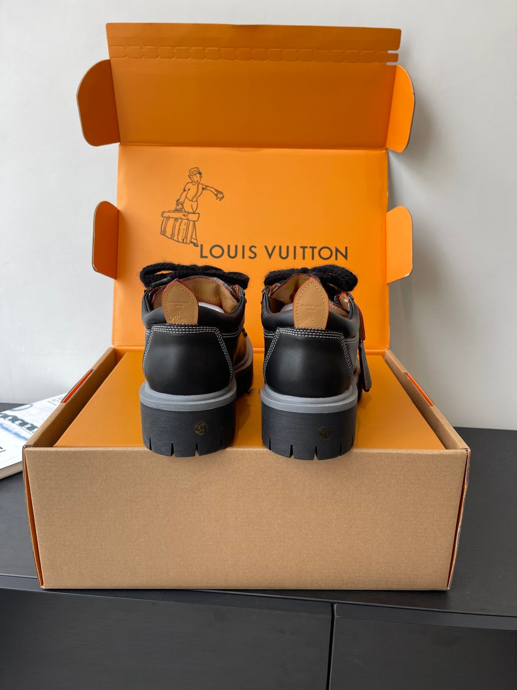 Louis Vuitton ladies sneakers: black lace-up shoes with fur trim and chunky tread sole