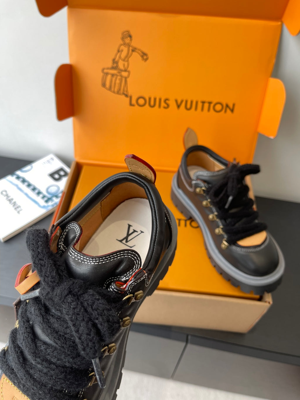 Louis Vuitton ladies sneakers: black lace-up with monogram details, fur cuff, padded tongue
