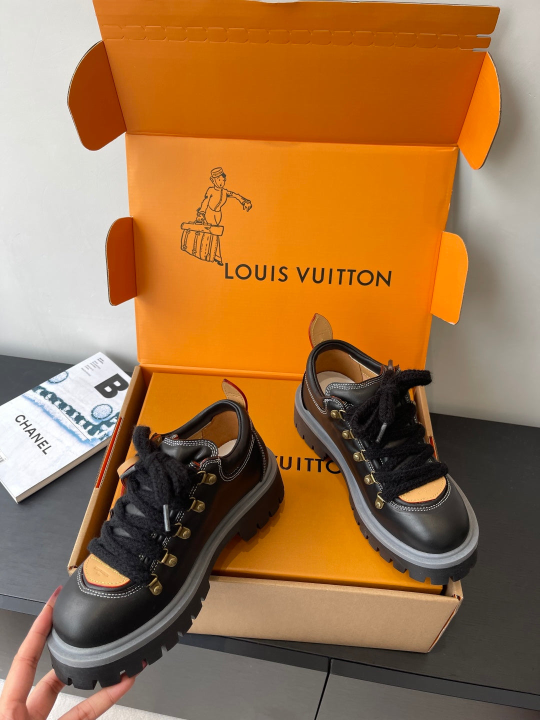 Louis Vuitton ladies sneakers: black lace-up with tan-lined interior and fur ankle cuff