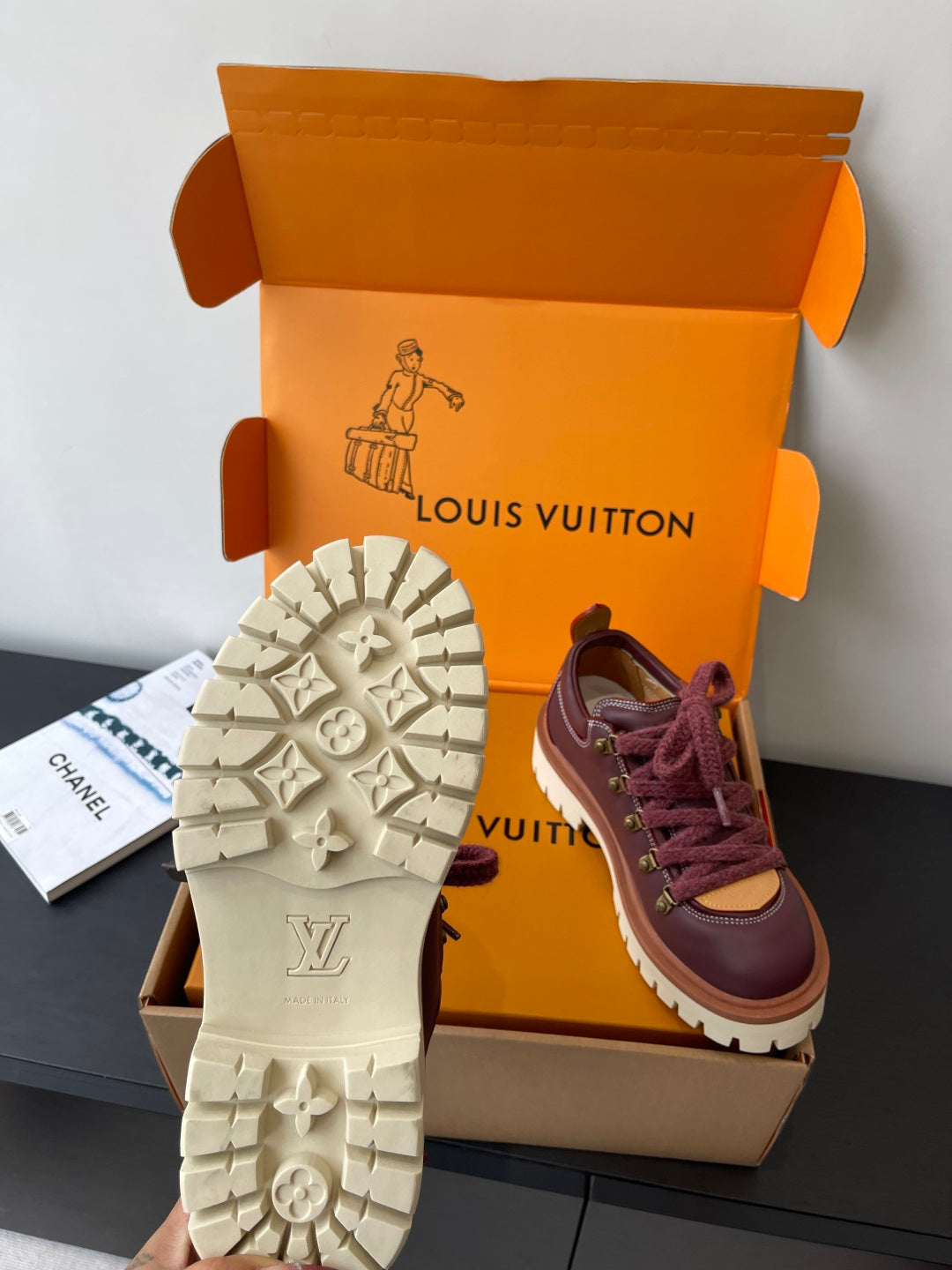 Louis Vuitton women's sneakers showing treaded outsole with stars and dark purple upper