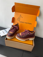 Louis Vuitton women's sneakers side-by-side, dark purple uppers with purple laces