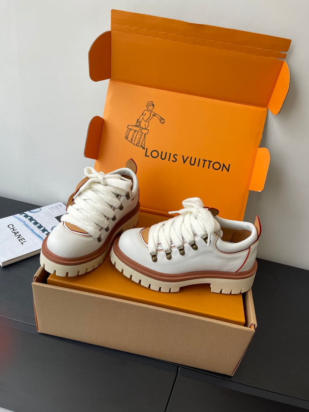 Louis Vuitton women's white lace-up sneakers with thick brown-rimmed sole