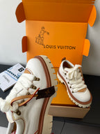 Louis Vuitton women's white sneakers with brown lace tips and gold eyelets