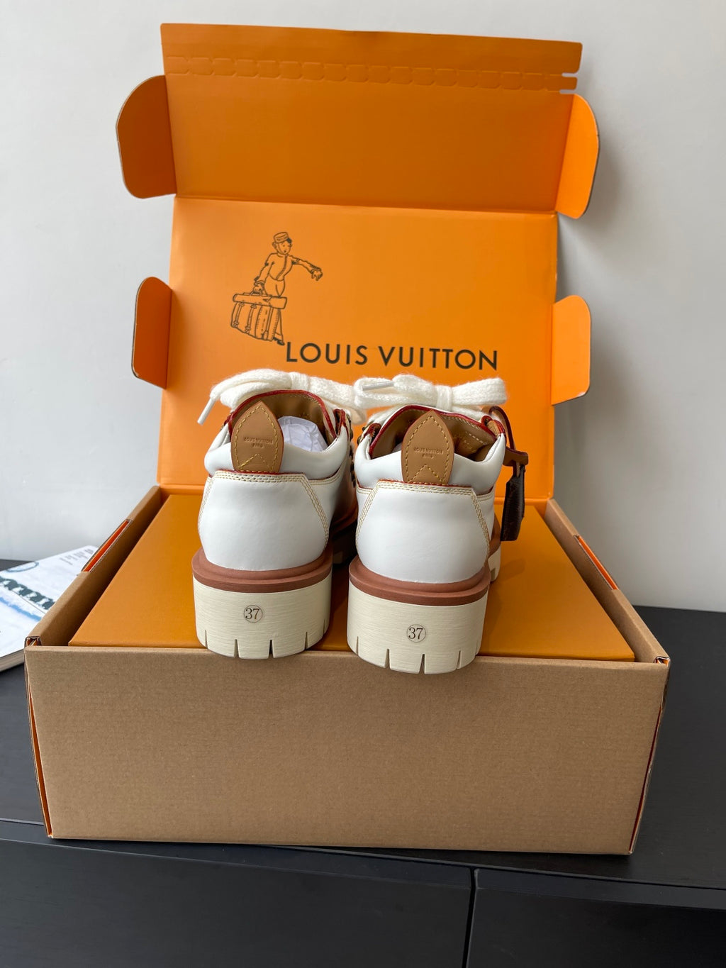 Louis Vuitton women's white sneakers back view with brown sole trim in box