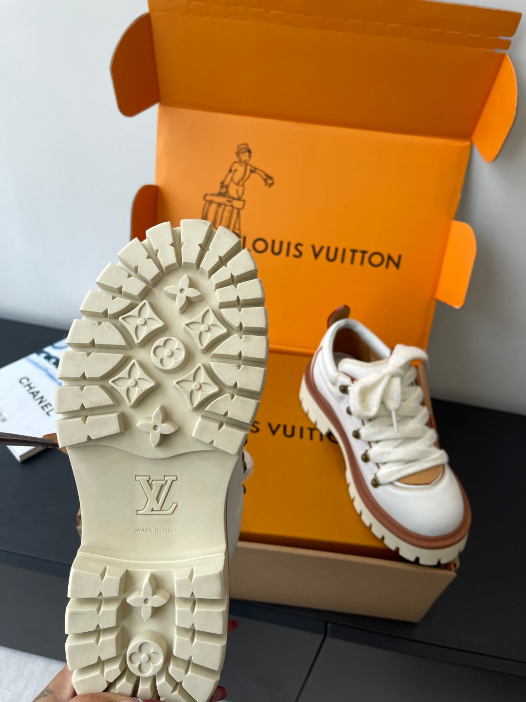 Louis Vuitton women's white sneaker outsole with tread pattern, pair in box
