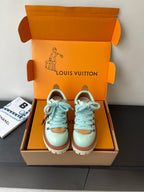 Women's mint leather sneakers with blue laces and brown trim, chunky sole